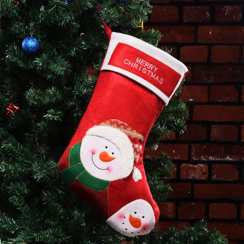 Red Christmas stocking with elk and snowman pattern, made from non-woven fabric with hanging loop.