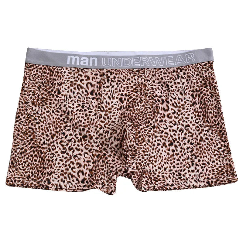 Men's loose fit leopard print underwear in grey and yellow, showing mid-waist design and soft fabric texture.