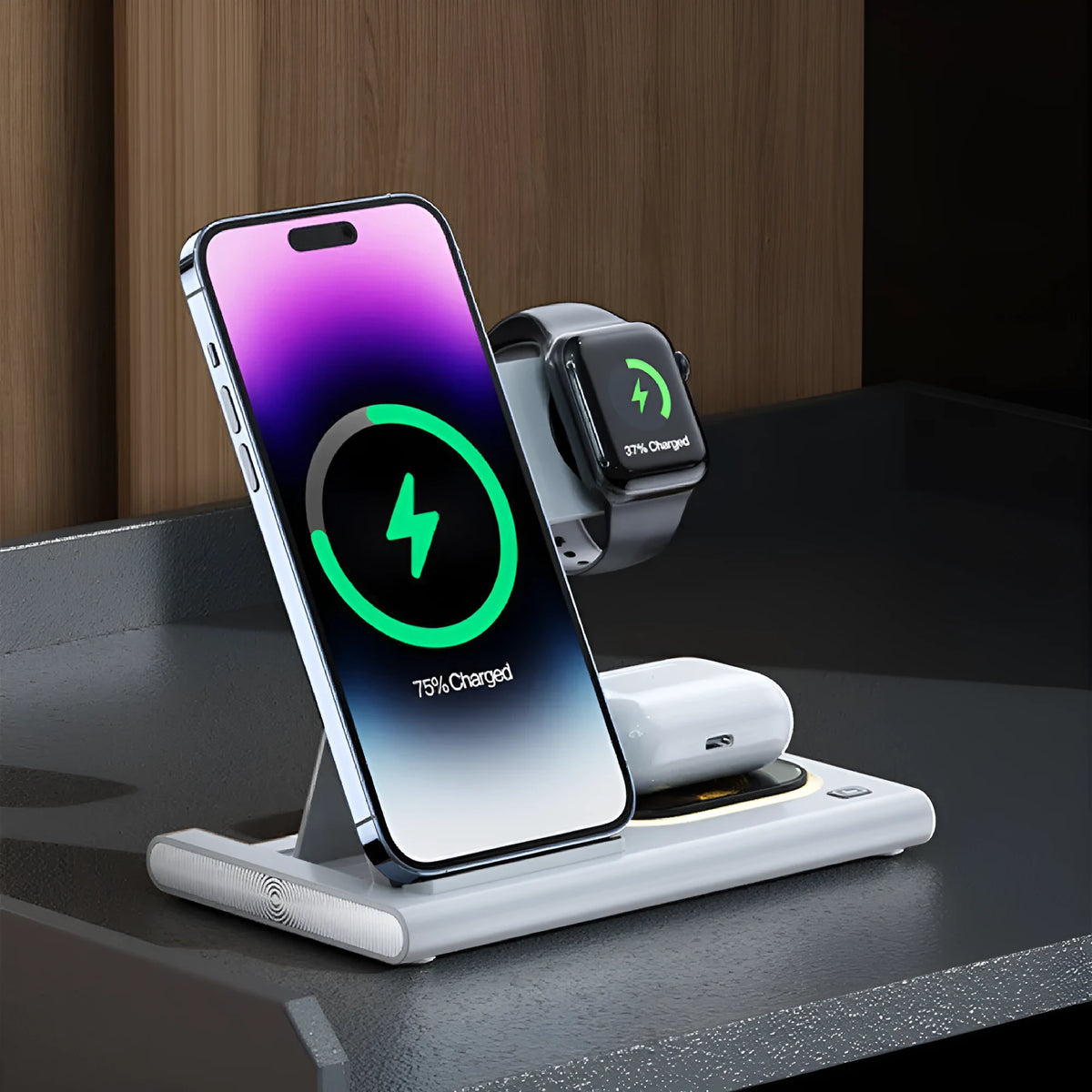 Black folding four-in-one wireless charger on a desk, showing its compact size and USB connection.