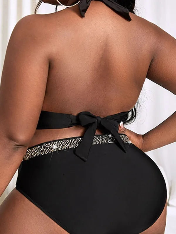 Plus size black women's two-piece bikini swimsuit on a hanger