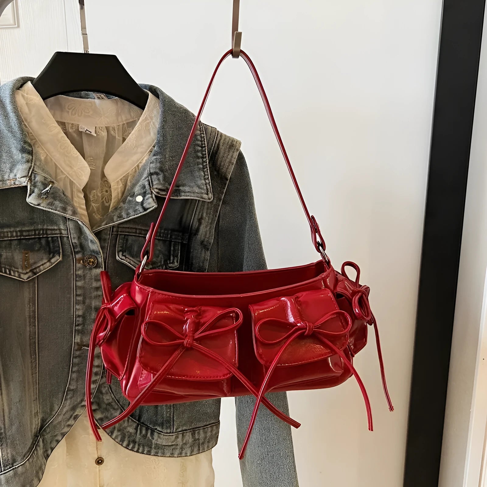 Women's shoulder bag with tassel bow decoration and pleated multi-pocket design in various colour options