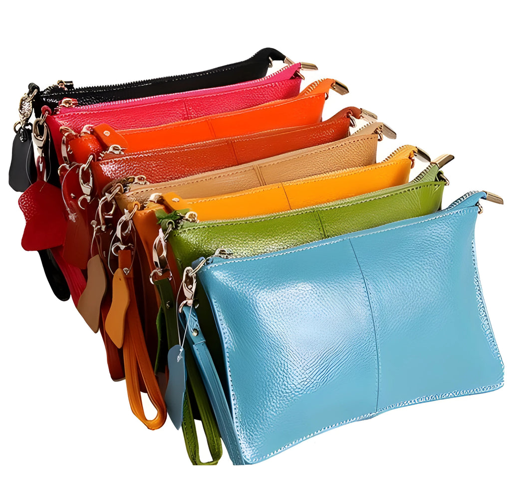 Lady's cowhide leather slant bag in apricot colour with hand strap and shoulder strap showing zipper compartments