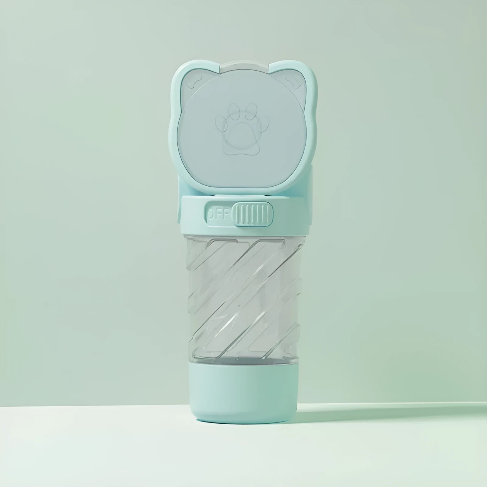 Green 3-in-1 pet water bottle with food container and waste bag dispenser, showing carrying strap.