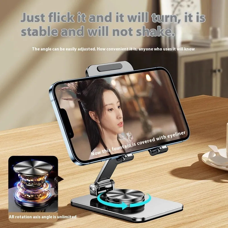 Rotatable folding mobile desktop stand in black on desk holding smartphone
