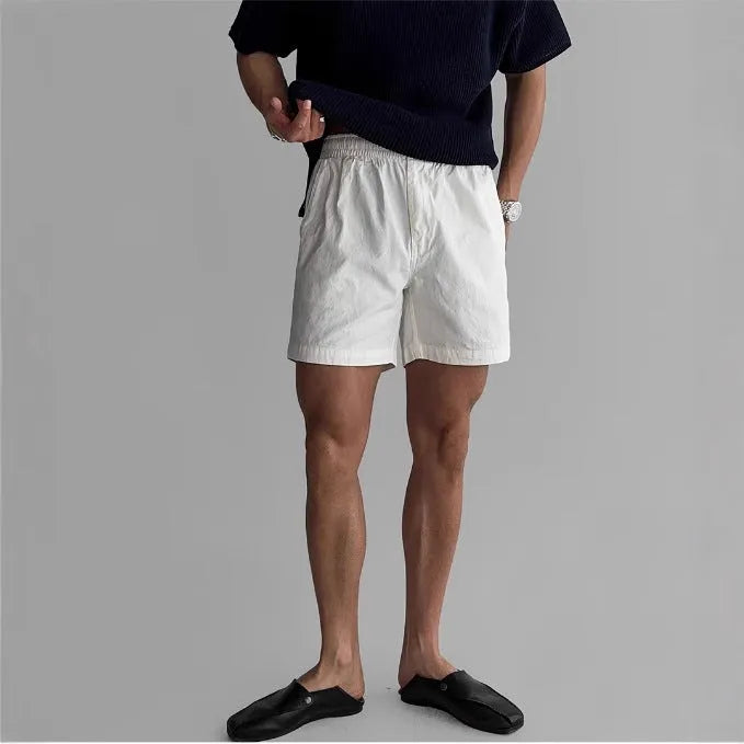 Cotton loose fit sports shorts in black, white, and khaki colours for summer athletic wear