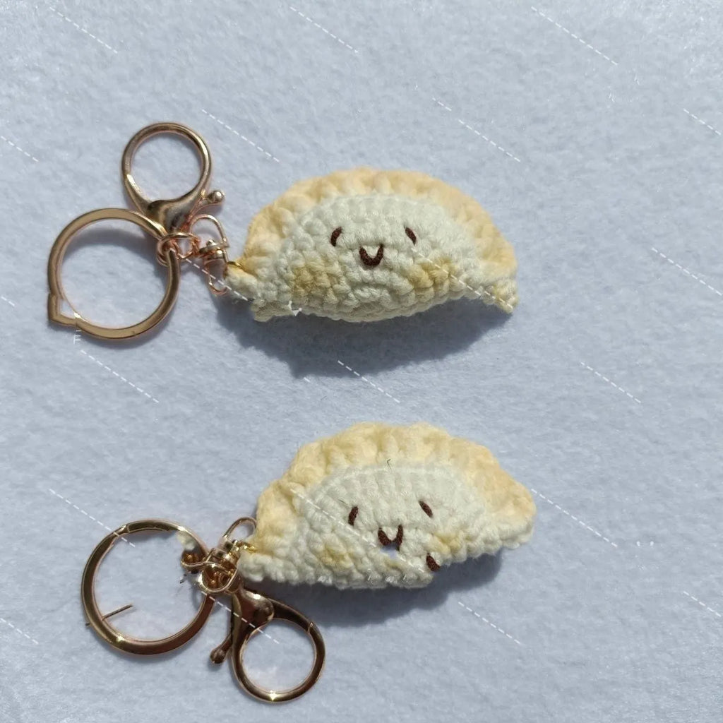 Handmade crochet dumpling pendant with plush texture and keychain in traditional festival design