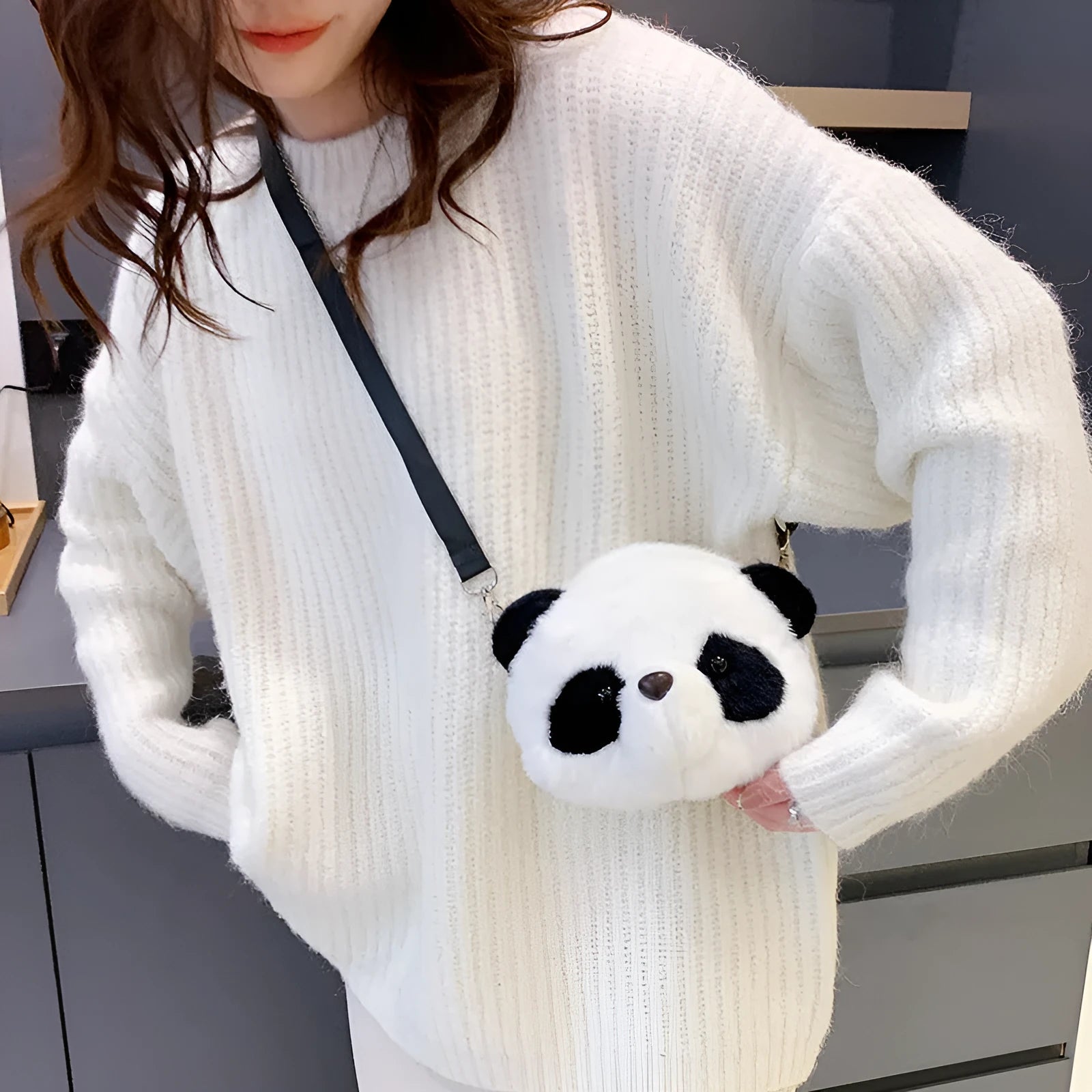 Soft plush cylindrical panda head crossbody bag with sandwich pocket.