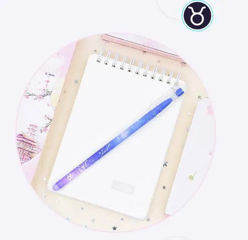 Box of 12 plastic gel pens with quick-drying ink and constellation-themed designs in assorted colours