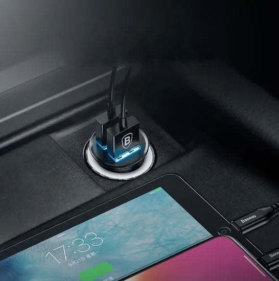Black USB car charger with 4.8A fast charging plugged into a vehicle power socket.