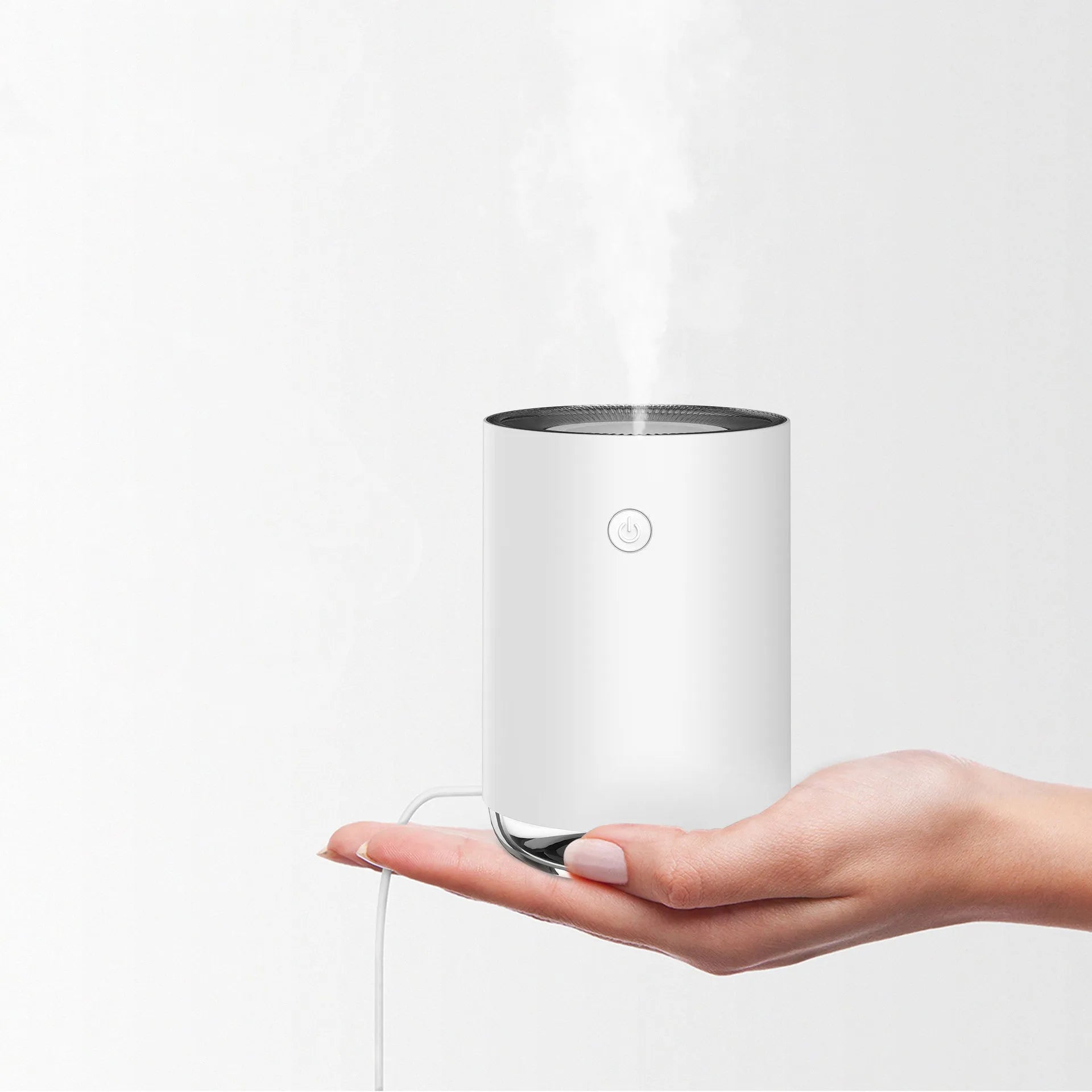 Green night light humidifier diffuser with coloured LED illumination and mist output