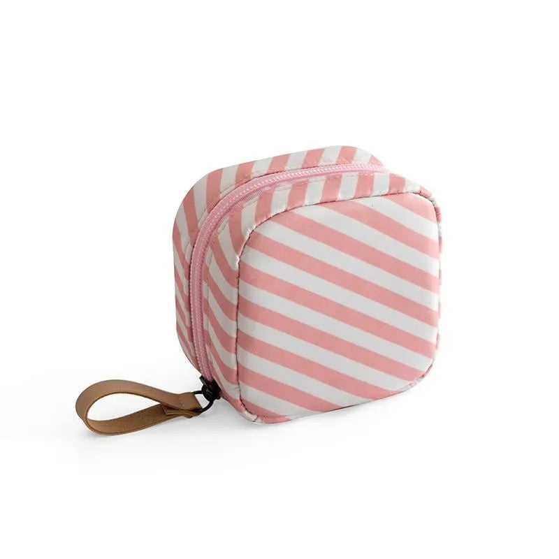 Cloth cube-shaped makeup storage bag with a plain pattern, shown in blue, pink, white, and white pink colour options