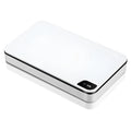 White multifunctional wireless charger with UV sterilisation and remote control on table