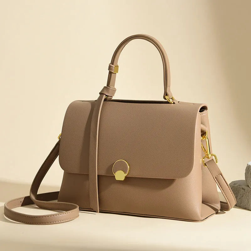 Soft PU cross-body handbag in beige, square vertical shape with sewing line detail, on white background