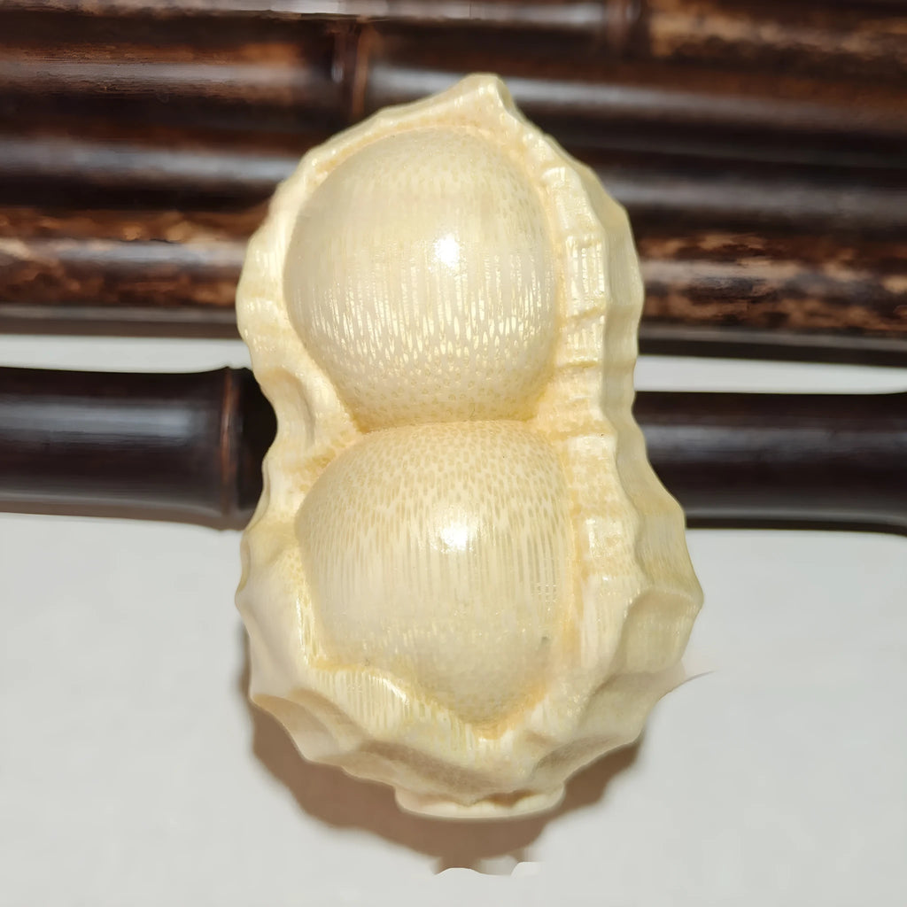 Natural solid bamboo peanut ornament with 'May Good Things Happen' engraved message.