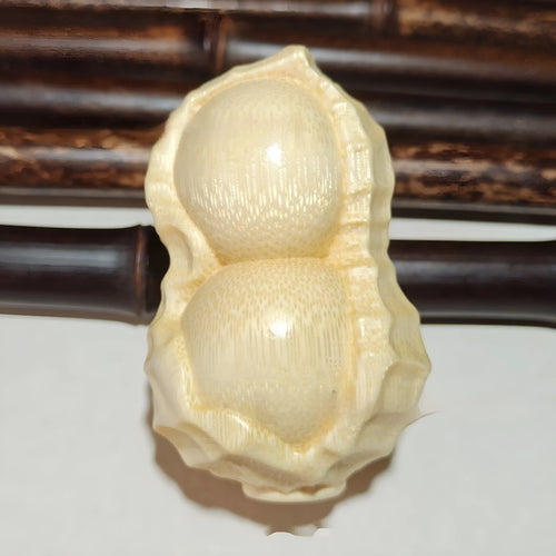 Natural solid bamboo peanut ornament with 'May Good Things Happen' engraved message.