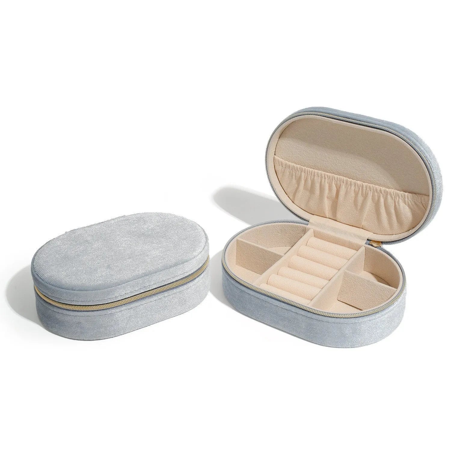 Oval velvet jewellery storage box in multiple colours with flannel lining, showing compact 15x10x5 cm size.