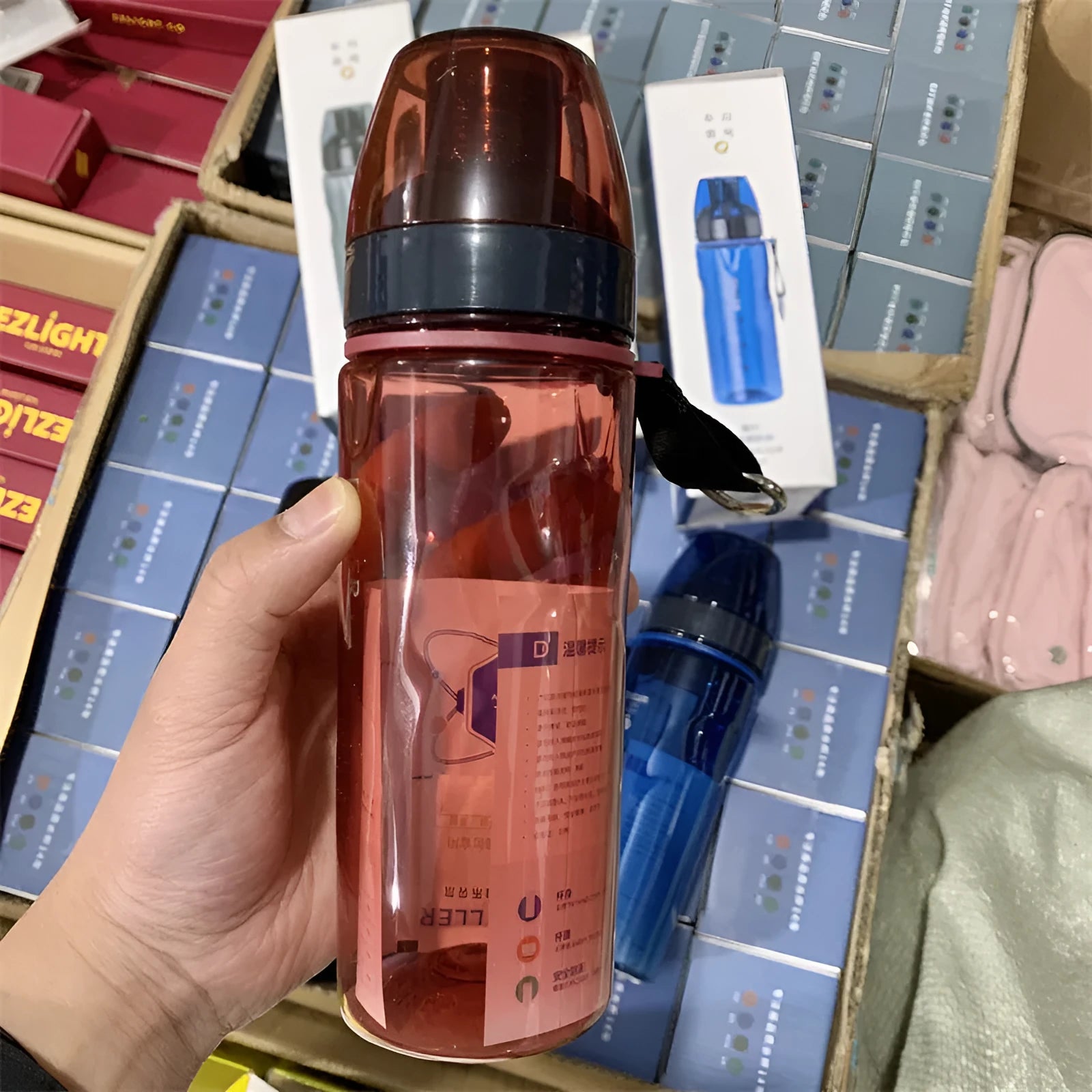 Blue portable sports water cup with a separate internal tea compartment and Chinese style design.