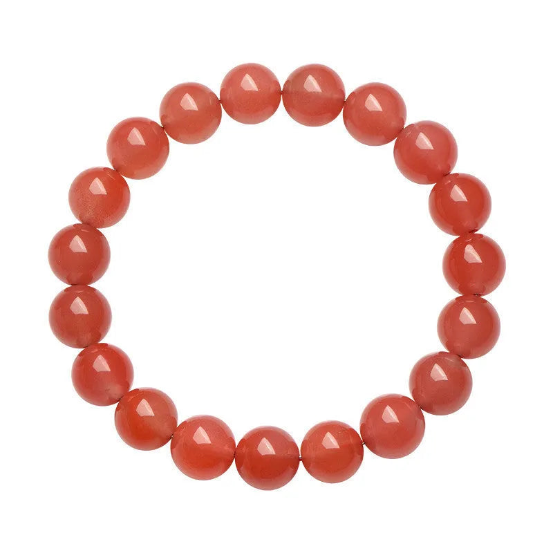 Natural South Cherry Red Agate bracelet with polished beads on an elasticated cord.