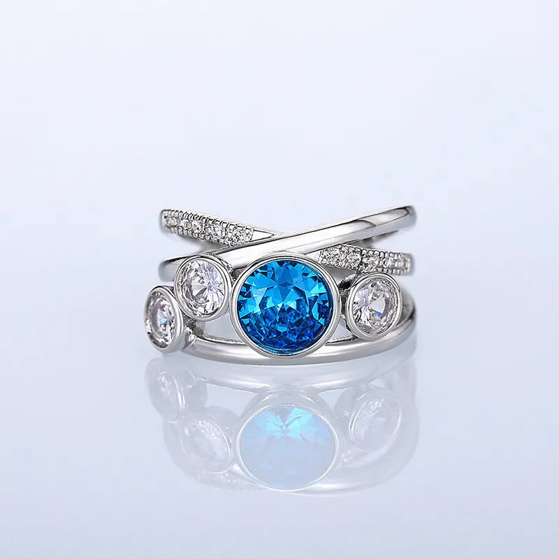 Retro hollow inlaid round copper ring in white gold colour with zircon stones