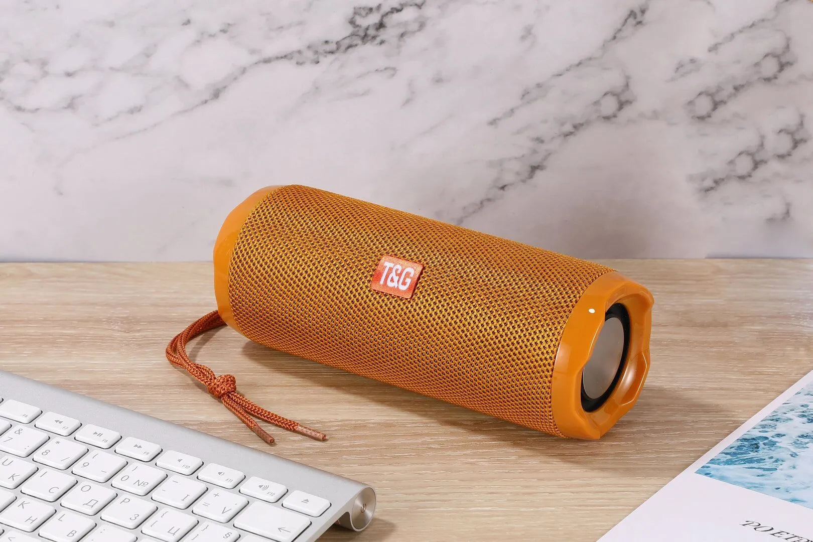 Fabric portable Bluetooth speaker with integrated card holder in multiple colour options.