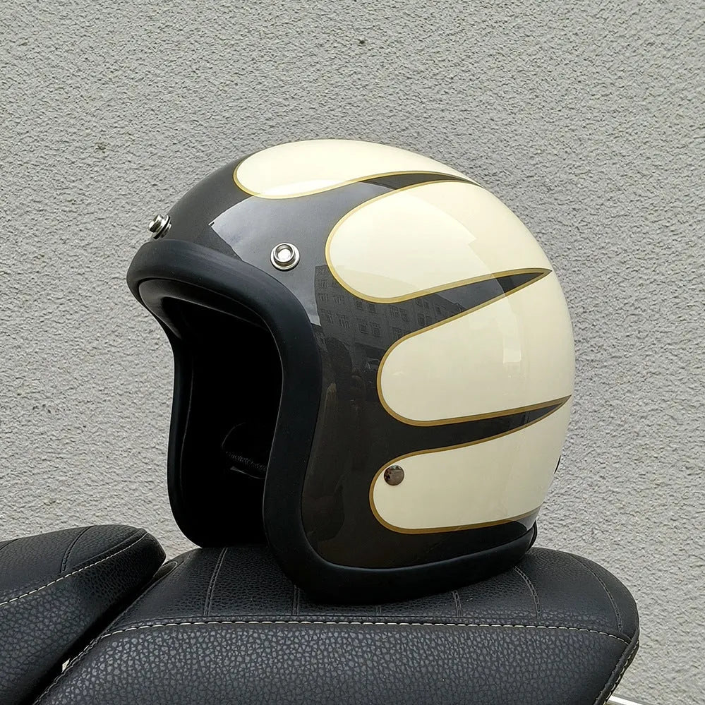 A retro-style grey half helmet for motorcycle riding, shown on a stand.