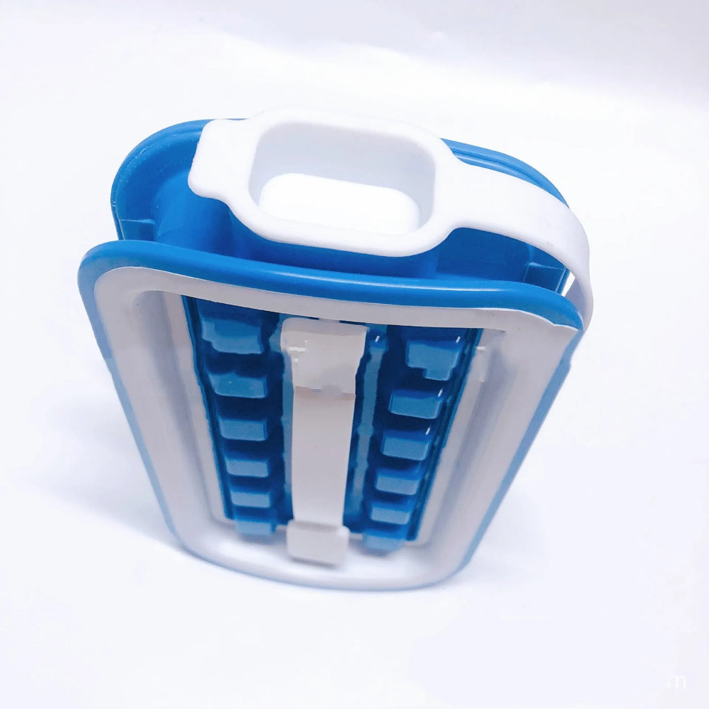 Blue silicone ice cube tray with 36 square cavities and a lid on a wooden table