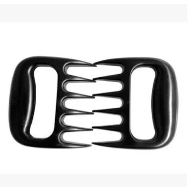 Black bear claw meat shredder utensil for pulling pork and chicken on a kitchen surface.