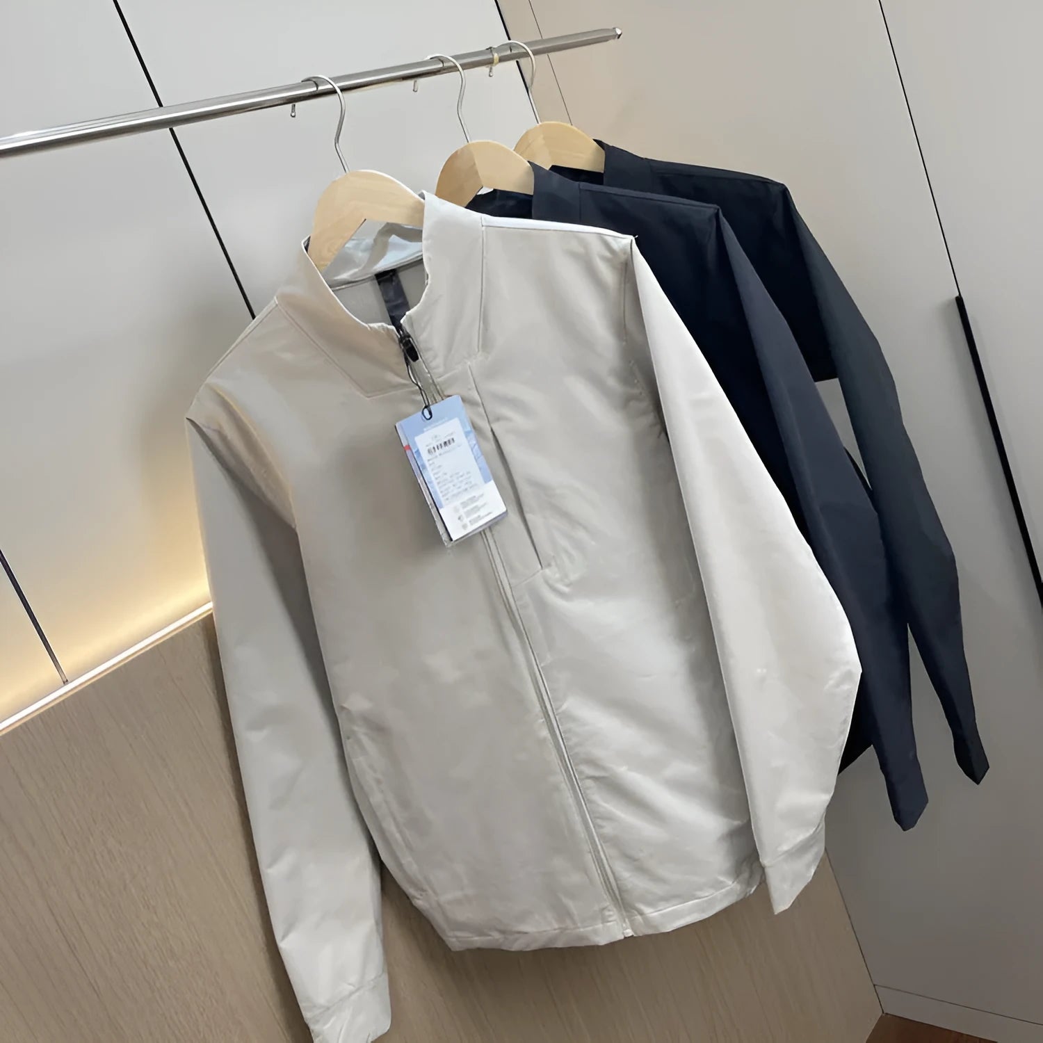 Men's black stand collar polyester sports casual jacket with long sleeves and straight hem