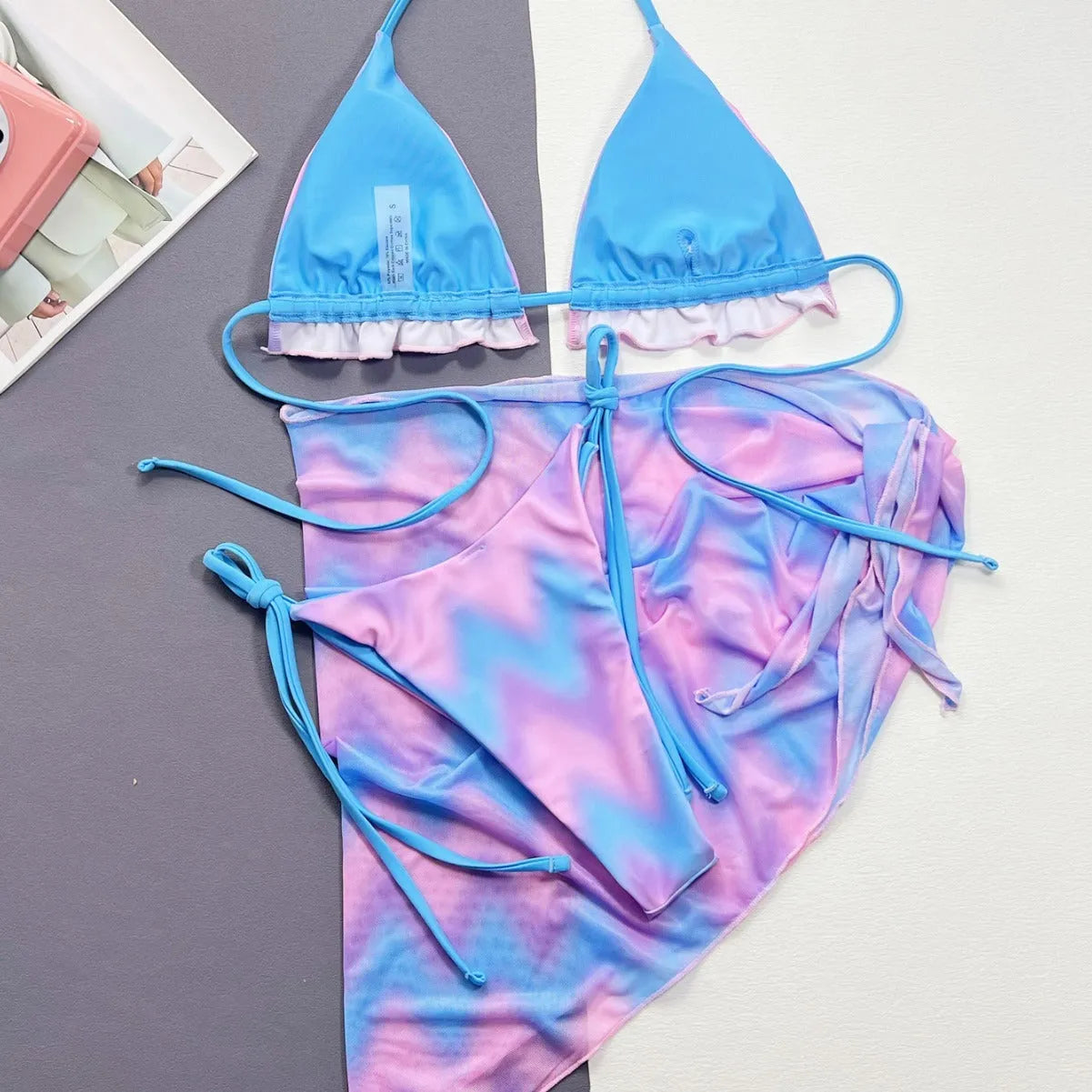 Women's tie-dye bikini swimsuit set with matching high-waisted skirt