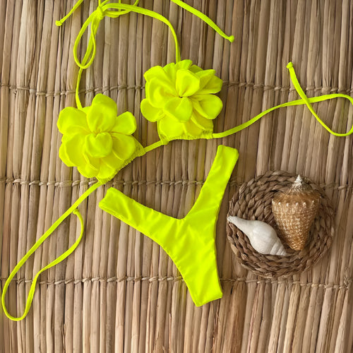 Women's low waist bikini swimsuit with 3D flower design in solid colour