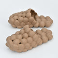 Creative Herringbone Baotou thick-soled bathroom slippers in orange, EVA sole with textured tread and upturned toe