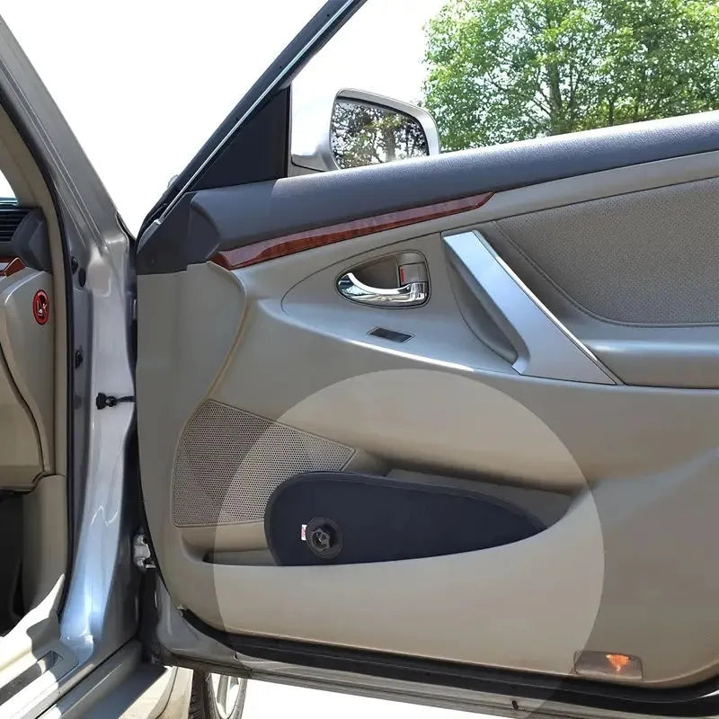 Black breathable car window shade with suction cups attached to a car side window for baby sun protection