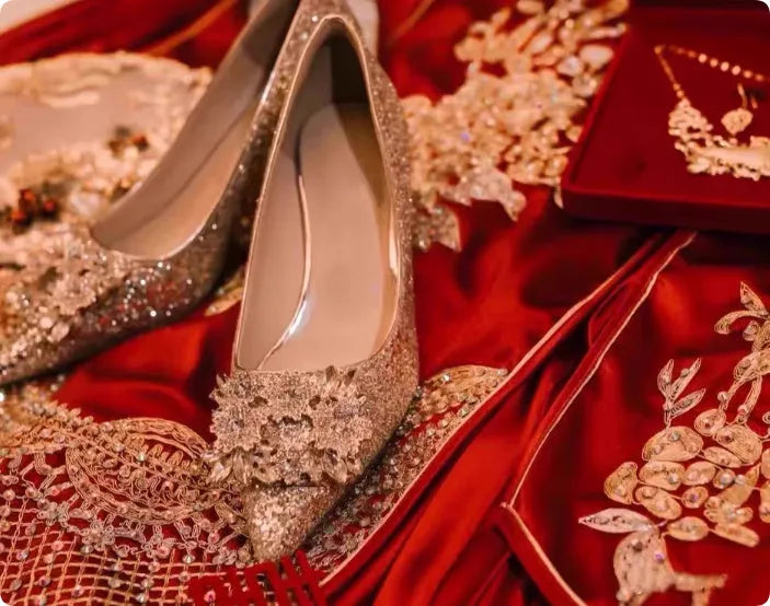 Champagne coloured women's wedding shoes with rhinestone flower pattern, pointed toe, and a fine heel.