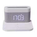 White bedside table lamp with integrated wireless phone charger and clock display