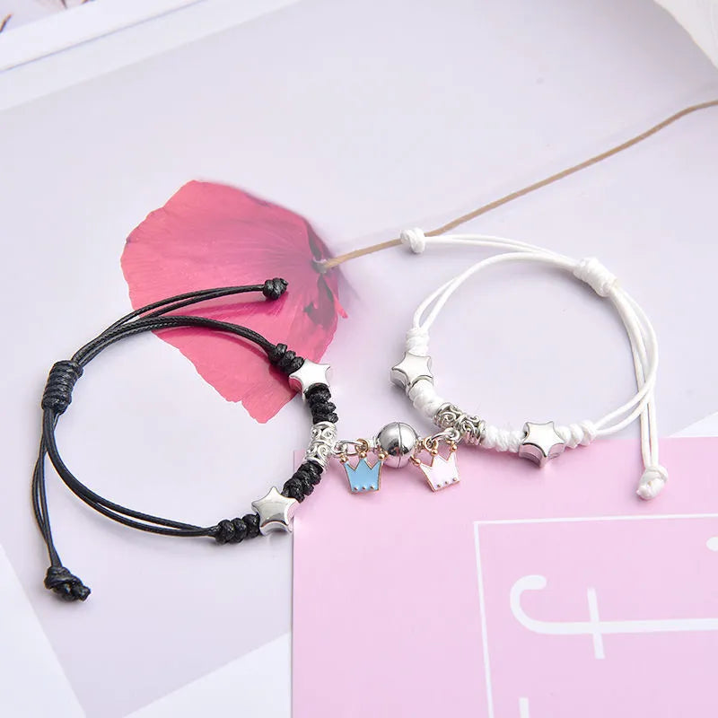 Magnet couple bracelets with electroplated finish showing magnetic clasp and symbolic design options