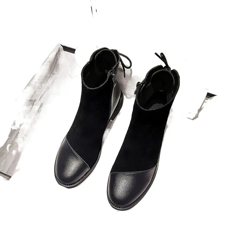 Black women's knee-high Martin boots with side zipper, round toe, and decorative bow.