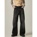 Black loose straight retro jeans with zipper fly closure on plain background