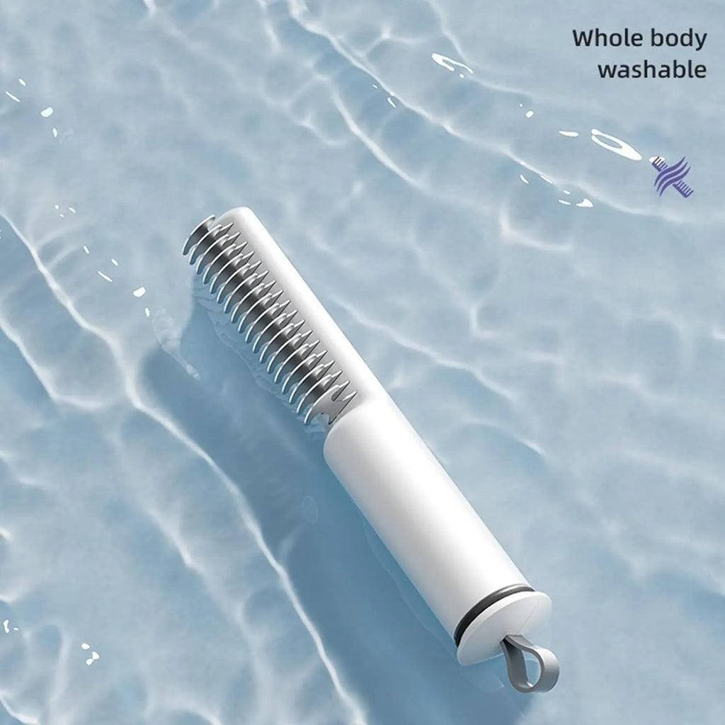 Stainless steel dematting comb with ergonomic handle for removing knots from dog or cat hair.