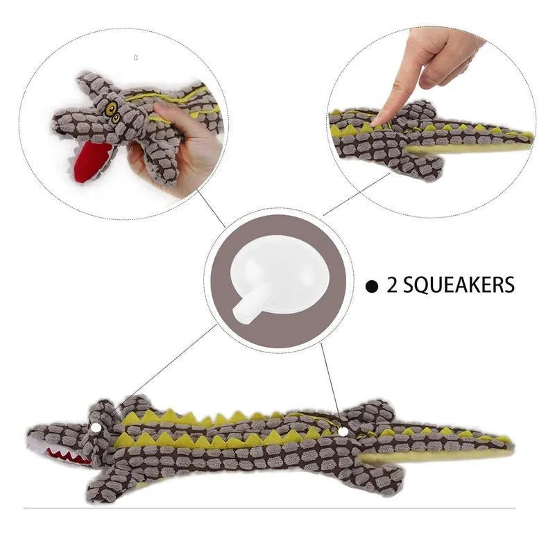 Blue crocodile-shaped plush squeaky dog toy with corduroy fabric on a wooden floor.