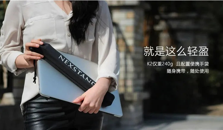 Sagacious black foldable laptop stand with enhanced nylon construction on desk