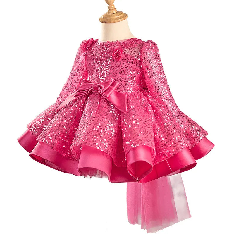 Girl's rose red sequined tulle tutu dress on child, polyester fabric, full skirt, side view