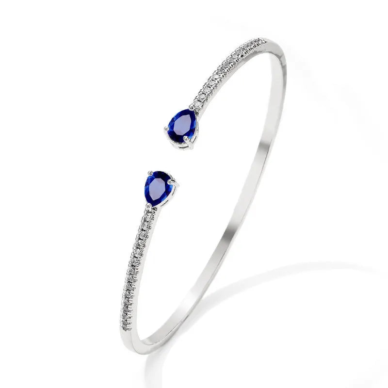 Copper personalised bracelet with multi-zircon inlay detail in white or blue colour