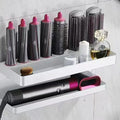 White double-layer aluminum bathroom storage rack with Marcel wave curlers organised on adhesive-mounted wall unit