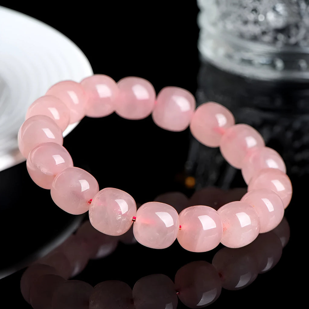 Natural pink crystal barrel bead bracelet with geometric design and polished finish