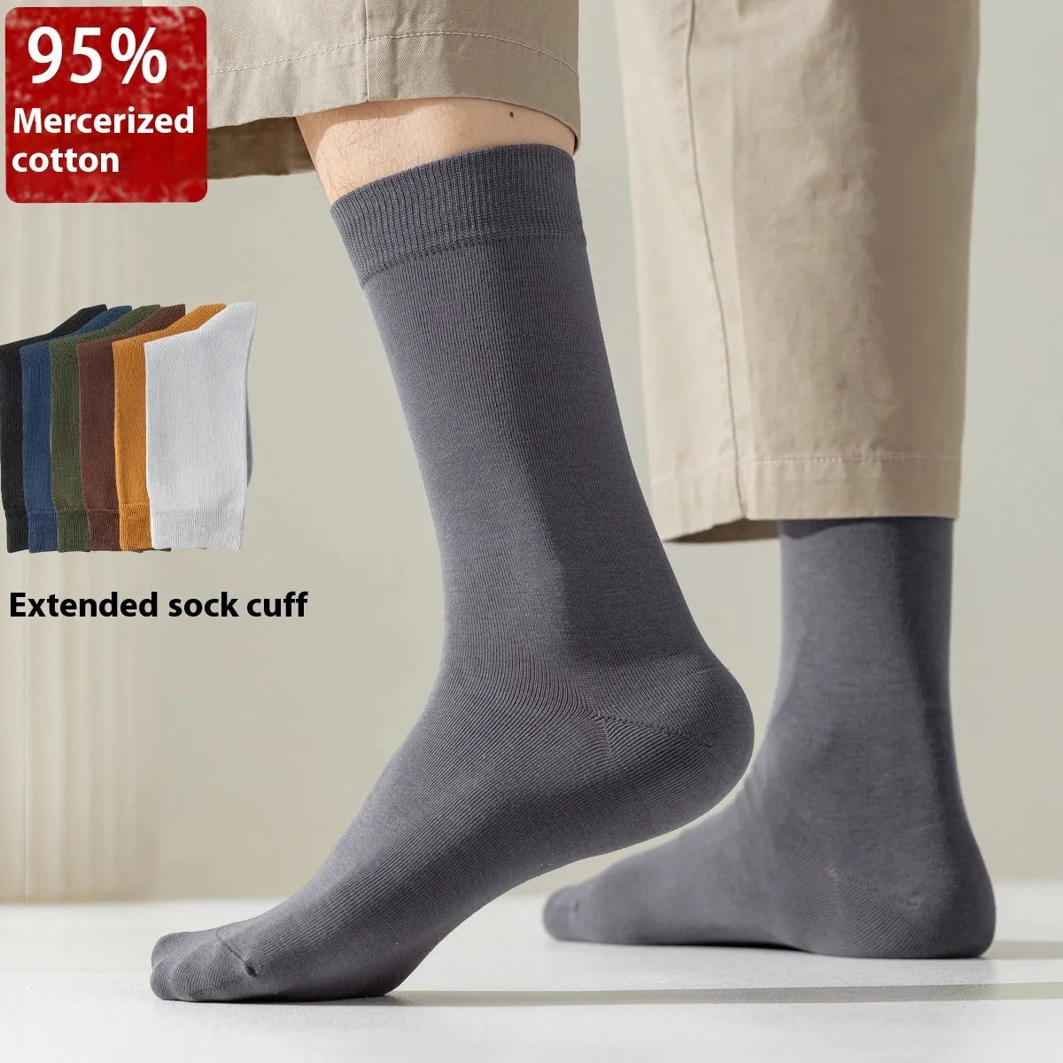 Five pairs of men's solid colour mid-calf socks made from combed cotton, shown in assorted shades.