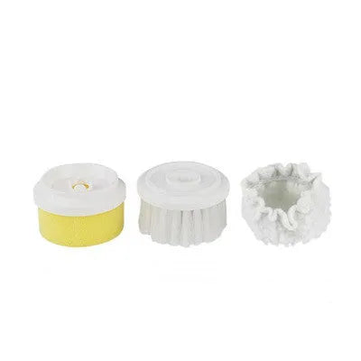 White cordless electric cleaning brush with three interchangeable brush heads on a bathroom sink