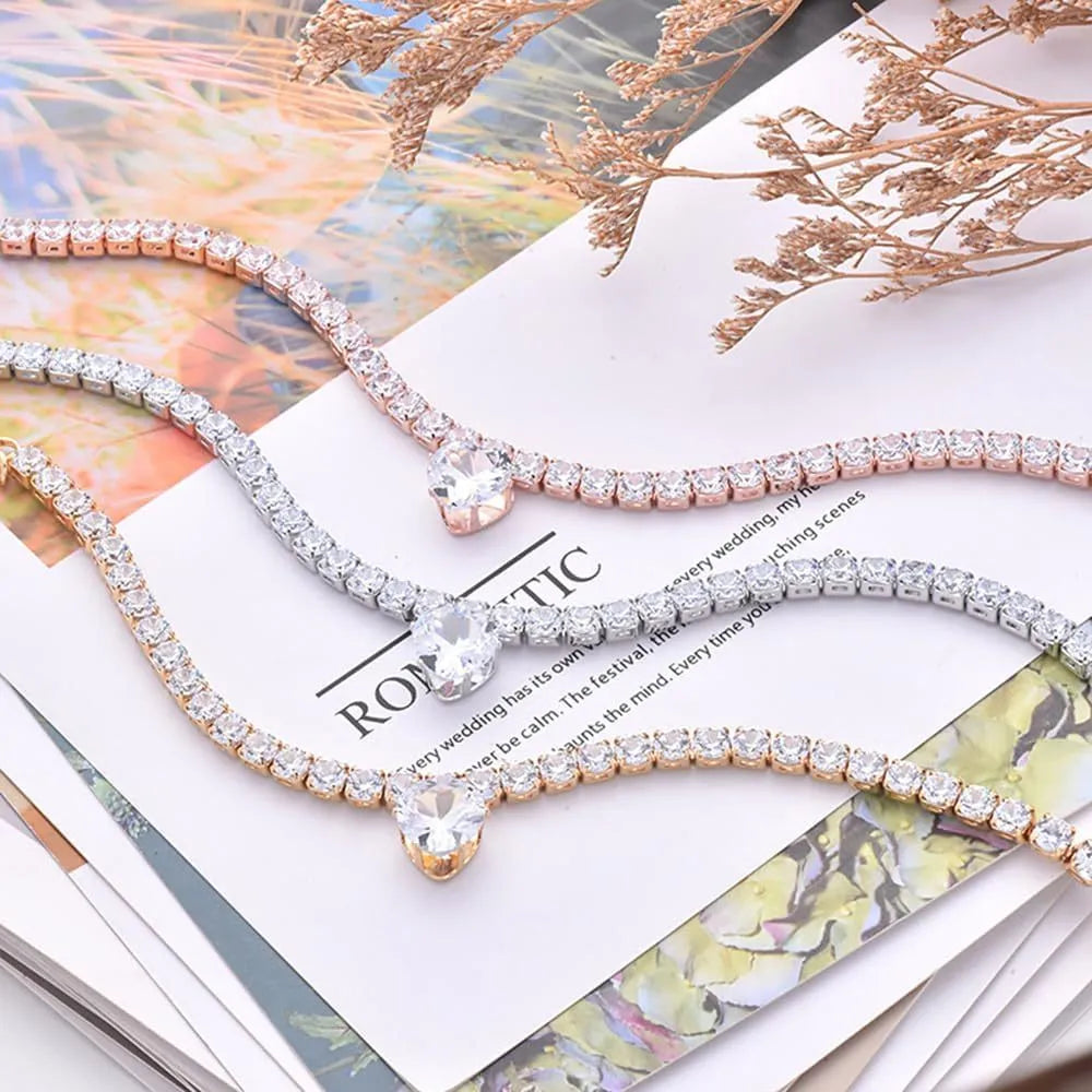 Heart-shaped rhinestone pet collar in metallic gold with extension chain for dogs and cats