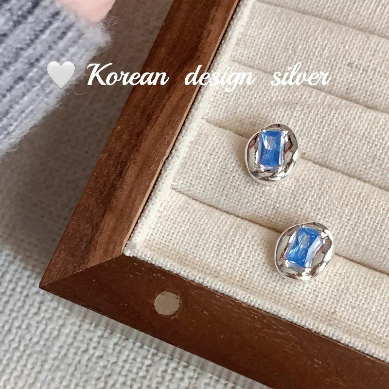 S925 sterling silver oval earrings with blue diamond heart-wrapped geometric design