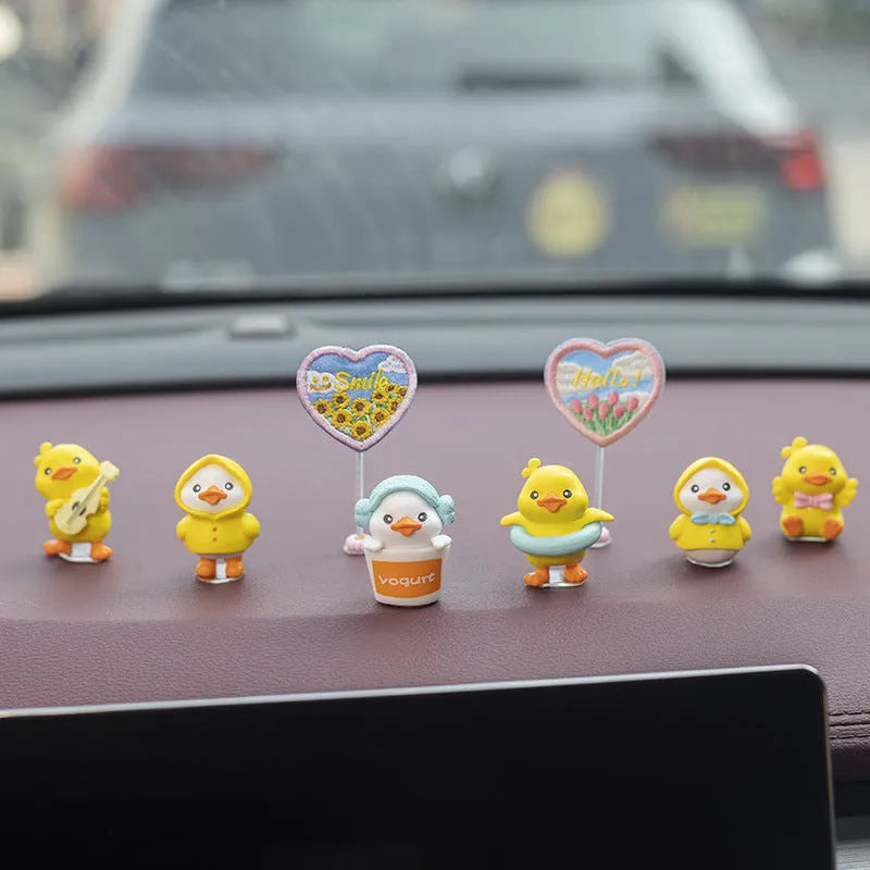 PVC cartoon duckling car decoration set with six small ducks and one hello welcome sign.