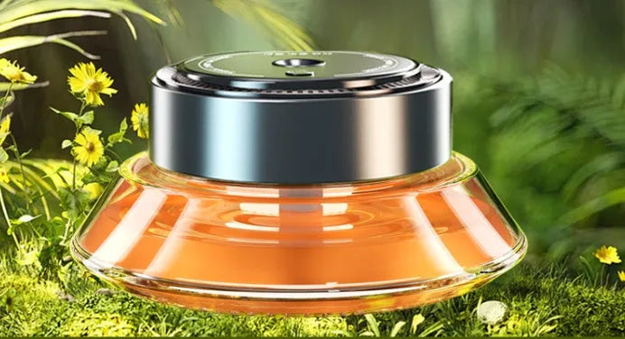 Smart spray car air freshener unit in Gentleman's Black or Qian Shan Cui colours with Ocean and Gulong fragrance refill bottles